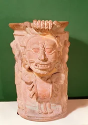 Cylindrical vase with the head of a sun god, Classic Period, 7th-10th century